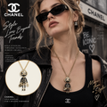 CHANEL Gold-Tone Doll Character Long Necklace with CC Charm