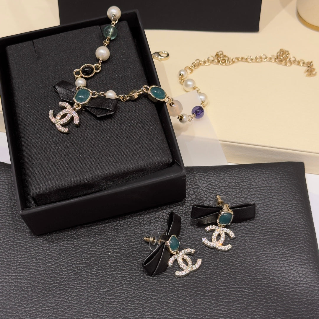 CHANEL Pearl Crystal Bow Earrings