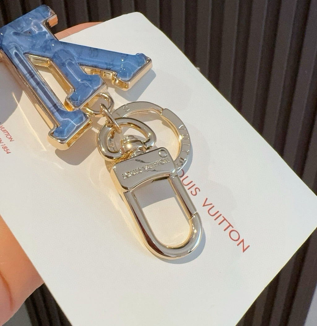 LOUIS VUITTON Metal Logo Bag Charm Keychain